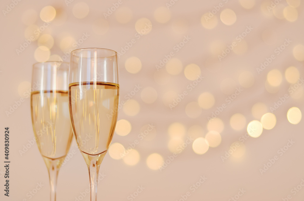 Two glasses of wine with bokeh background close up. Top view. New Year, Christmas mood. Greeting card. Party and holiday celebration concept. Two glasses of wine with bokeh background close up. Top view. New Year, Christmas mood. Greeting card. Party and holiday celebration concept.