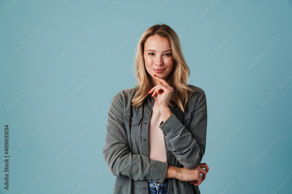 Happy beautiful blonde girl smiling and looking at camera Happy beautiful blonde girl smiling and looking at camera