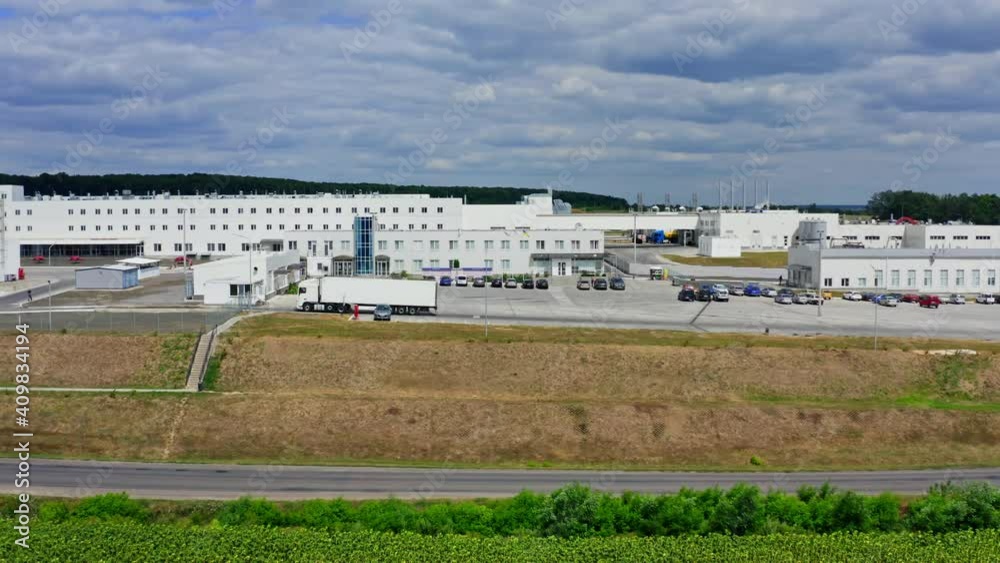 Agricultural facilities built in field. Modern factory buildings. Newly built big modern plant in rural area. Video from dron. Agricultural facilities built in field. Modern factory buildings. Newly built big modern plant in rural area. Video from dron.