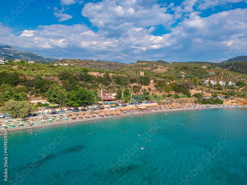 Aerial view over Santova coastal area in Messinia, Greece. Summer scenery with beautiful seaside bars and tourists in Santova near Kalamata city, Greece © panosk18
