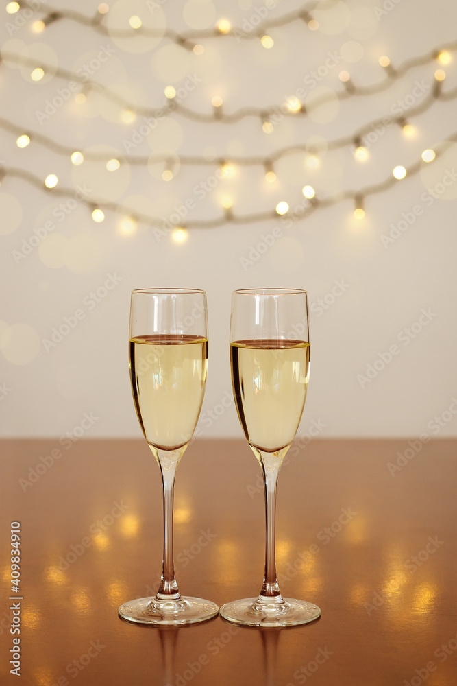 Two glasses of wine with bokeh background close up. Top view. New Year, Christmas mood. Greeting card. Party and holiday celebration concept. Two glasses of wine with bokeh background close up. Top view. New Year, Christmas mood. Greeting card. Party and holiday celebration concept.