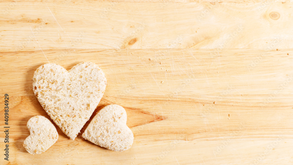 Obraz premium a heart shape cutted out of wholewheat bread