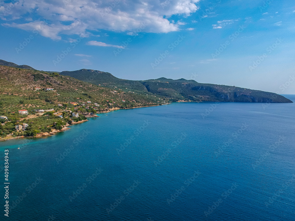 Aerial view over Santova coastal area in Messinia, Greece. Summer scenery with beautiful seaside bars and tourists in Santova near Kalamata city, Greece