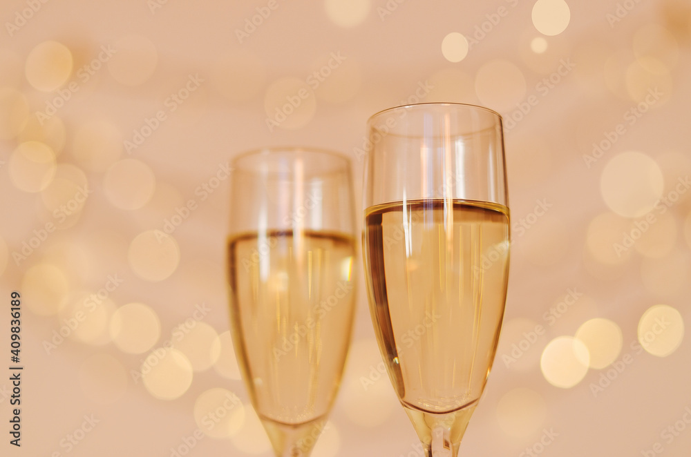 Two glasses of wine with bokeh background close up. Top view. New Year, Christmas mood. Greeting card. Party and holiday celebration concept. Two glasses of wine with bokeh background close up. Top view. New Year, Christmas mood. Greeting card. Party and holiday celebration concept.