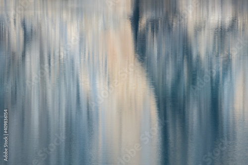 artistic reflection of a rock face in Oeschinensee