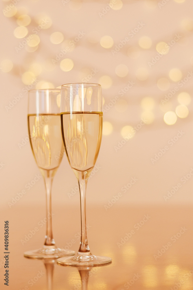 Two glasses of wine with bokeh background close up. Top view. New Year, Christmas mood. Greeting card. Party and holiday celebration concept. Two glasses of wine with bokeh background close up. Top view. New Year, Christmas mood. Greeting card. Party and holiday celebration concept.