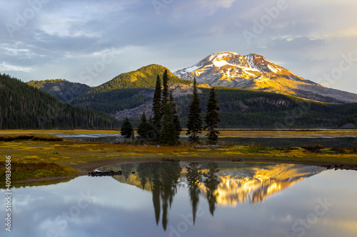 Beautiful morning lake landscape. Sparks Lake in Central Oregon at Sunrise. South Sister mount reflects in calm water of Sparks lake