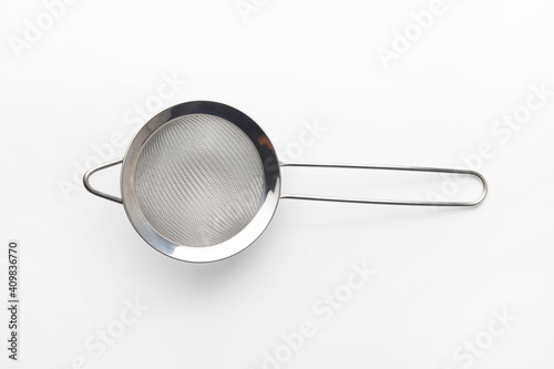 Close up of stainless steel fine mesh strainers all-purpose colander sieve isolated on white background. Copy space. photo