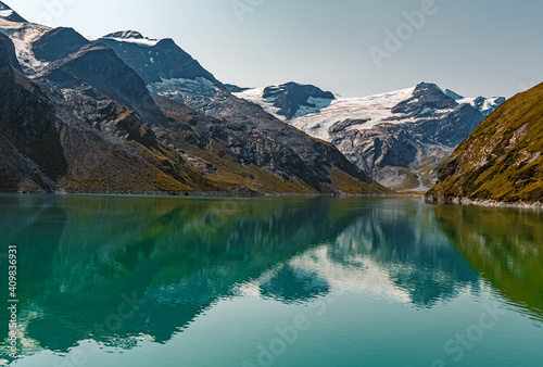 Beautiful alpine summer view with reflections at the famous Kaprun high mountain reservoirs, Salzburg, Austria © Martin Erdniss