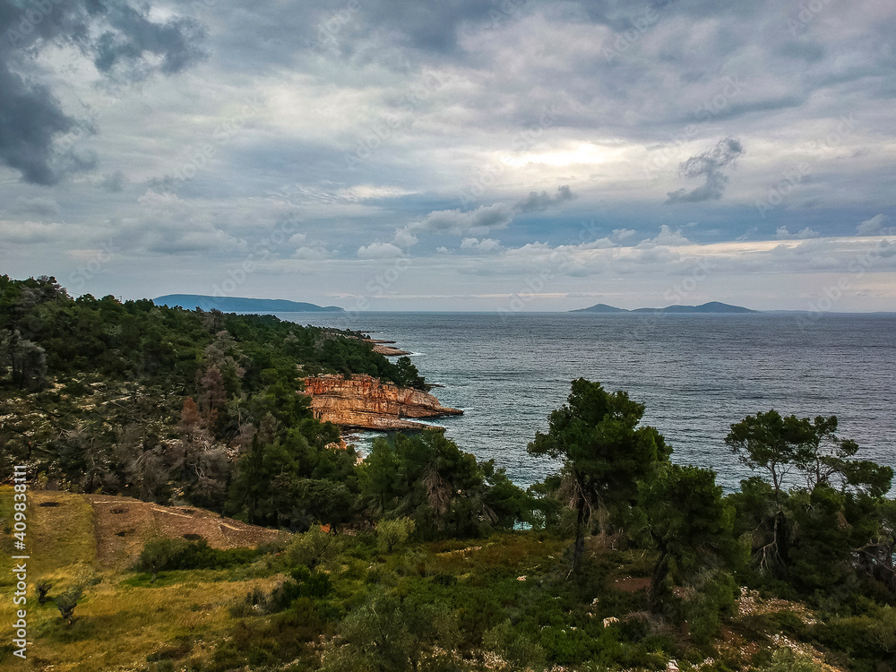 Fototapeta premium Aerial view over western Alonnisos island and the rock formation. Natural landscape, beautiful Greek scenery, spectacular view in Sporades, Aegean sea, Greece