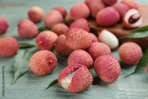Fresh ripe lychee fruits on wooden table