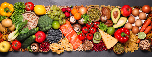Different products on black table, top view. Healthy food and balanced diet