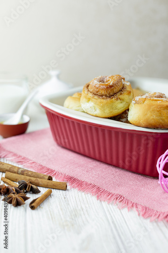 Cinnabon rolls at the baking tray. photo