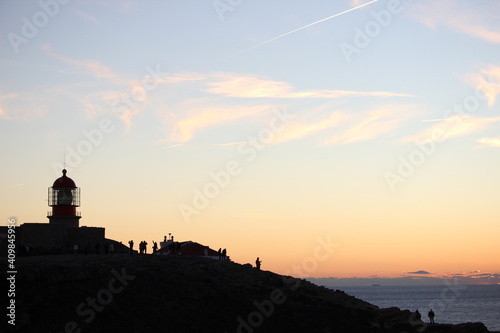 People against sunset in Sagres, Portugal