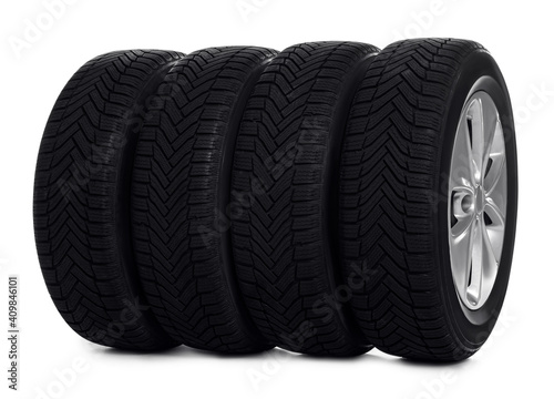 Set of wheels with winter tires on white background