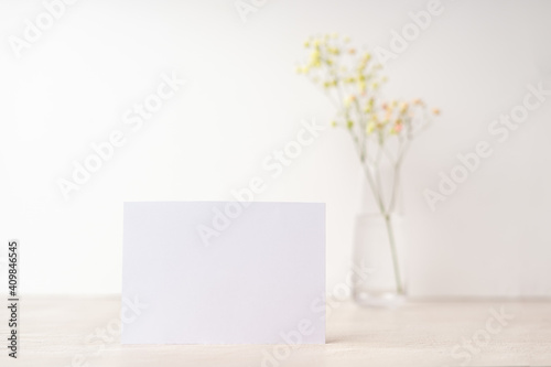 White blank letter greeting card, mockup on white background. Romantic love letter, invitation with flowers, copy space for text
