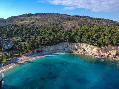 Deserted beach and modern resorts over Marpounda beach in Alonnisos island due to the measures against coronavirus pandemic disease in Sporades, Greece