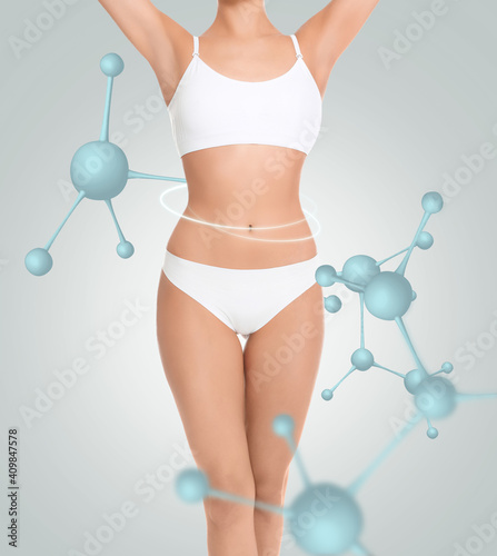 Metabolism concept. Woman with slim body and molecular chains on light background