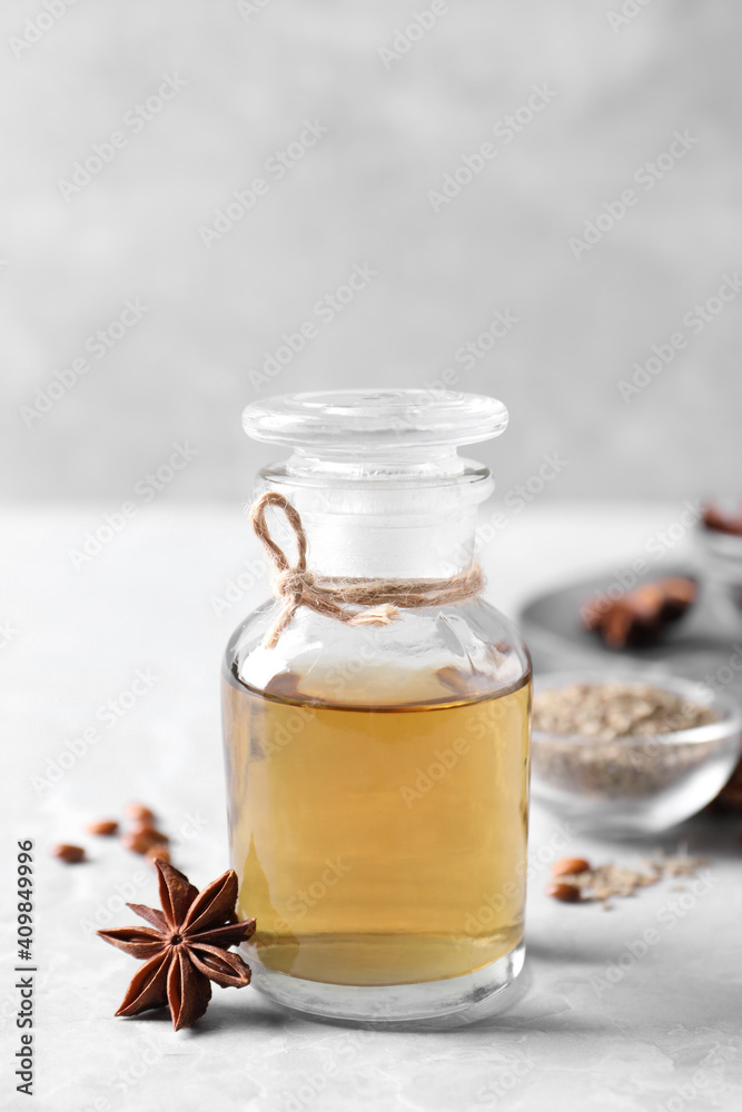 Anise essential oil and spice on light table Anise essential oil and spice on light table