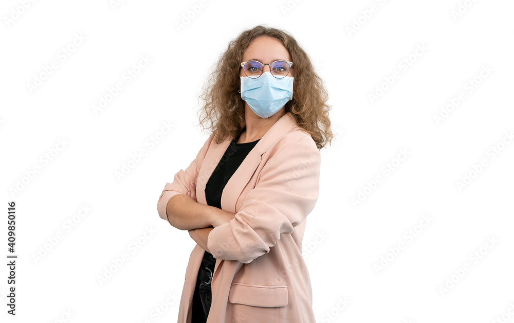 Business woman wearing a suit has her arms crossed and a mask, white background. Business woman wearing a suit has her arms crossed and a mask, white background.