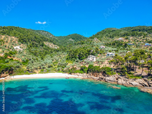Aerial drone view over Chrisi Milia beach and the rocky surrounded area in Alonnisos island, Sporades, Greece © panosk18