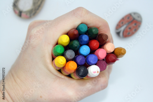 Colorful crayons for painting on a white background.