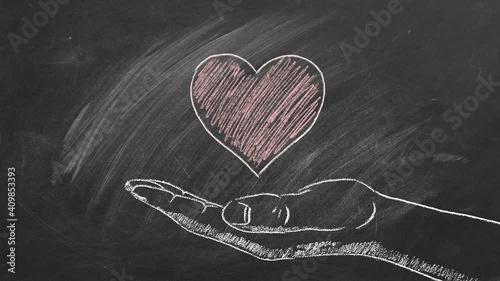 Heart in a man's hand. Chalk drawn illustration. Heart transplant and organ donation concept. The concept of charity, love, donate and helping hand. I Love You. Happy Valentine's day. World heart day photo