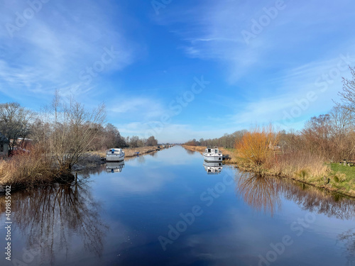 Canal around Tijnje during a winter day photo