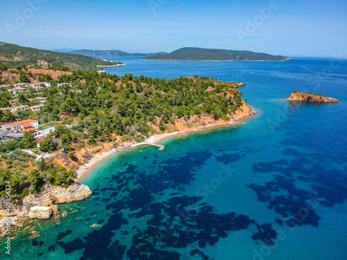 Aerial drone view over Chrisi Milia beach and the rocky surrounded area in Alonnisos island, Sporades, Greece © panosk18