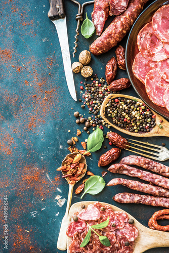 Sausages with spice and cutlery, view from above