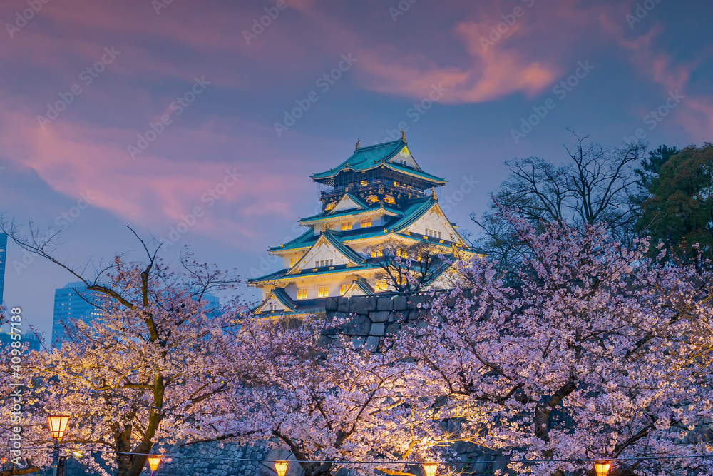 Twilight at Osaka castle during Cherry blossoms season Twilight at Osaka castle during Cherry blossoms season