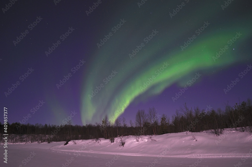 aurora borealis, northern light on winter night sky in northern Norway