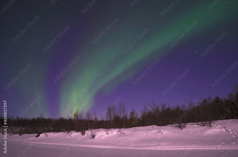 aurora borealis, northern light on winter night sky in northern Norway