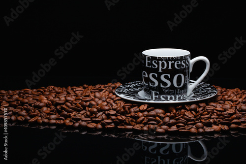 Coffee mug on a pile of coffee beans