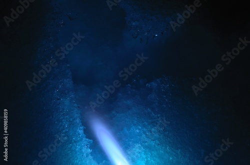 blue gas flame melting white snow at night