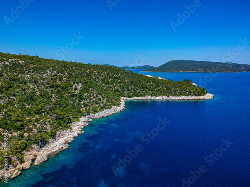 Aerial view over Leftos Gialos beach in Alonnisos island, Sporades, Greece © panosk18