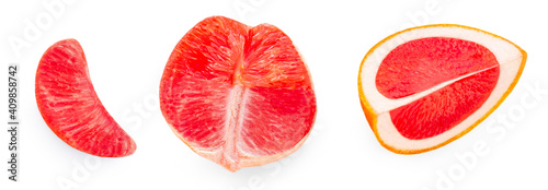 Creative layout made of Grapefruits isolated on white background. Pink grapefruit slices and wedges Flat lay. Top view. .