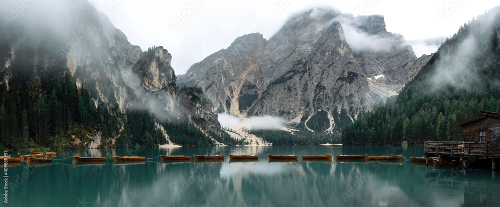 Beautiful lake with boats in the Italian alps, Lago di Braies 