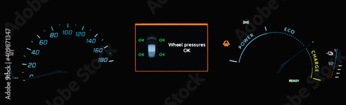 TPMS (Tyre Pressure Monitoring System) monitoring display on car dashboard panel. Checking tires pressures. Car instrument cluster with speedometer, power and battery charge gauge in electric vehicle.