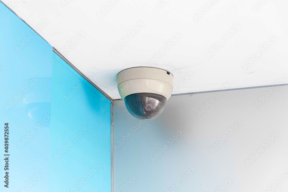 Round cctv camera mounted on the ceiling at the bank Round cctv camera mounted on the ceiling at the bank