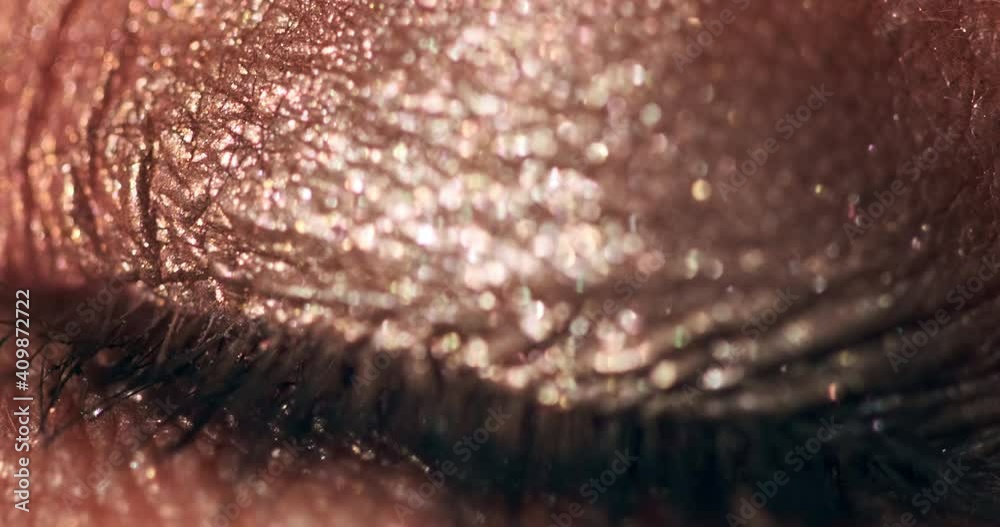 Woman's eye macro. Extreme macro clip of the blue woman's eye with make up