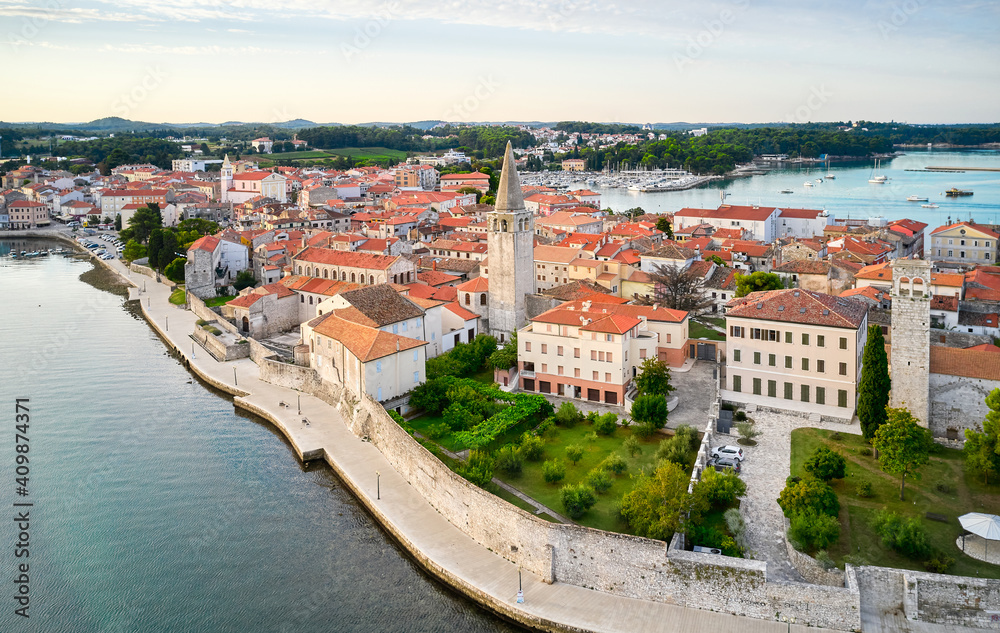 A fragment of the old town embankment with the cathedral. Porec, Croatia. Shooting from a drone.