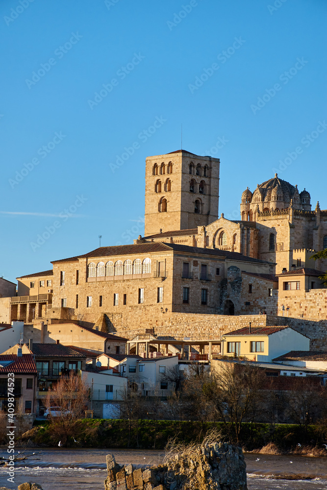 Vertical view of the cathedral of Zamora at sunset with the Duero River