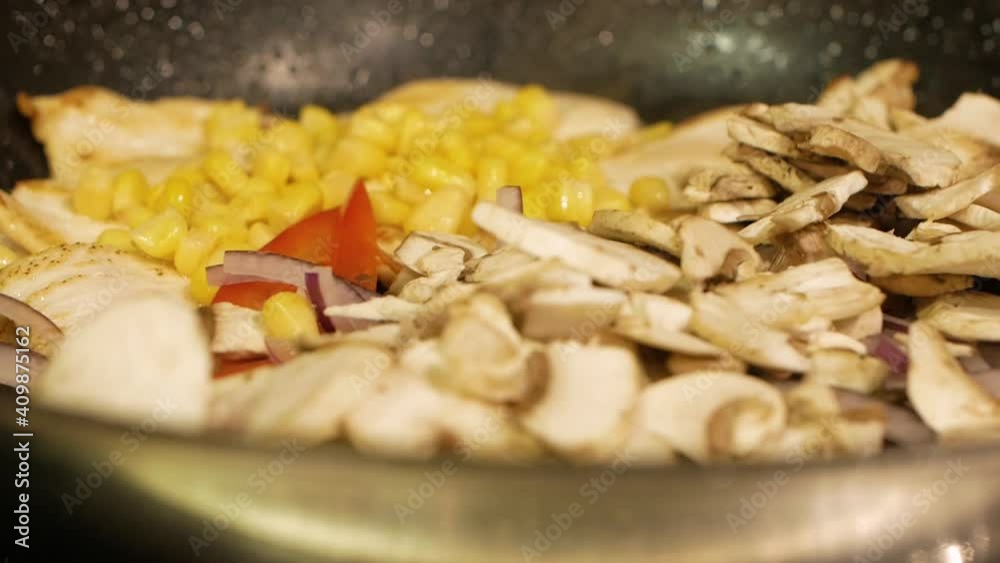 chef cooking hot wok with chicken and vegetables chef cooking hot wok with chicken and vegetables