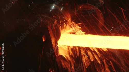 red hot metal bars in continuous casting machine at metallurgical plant