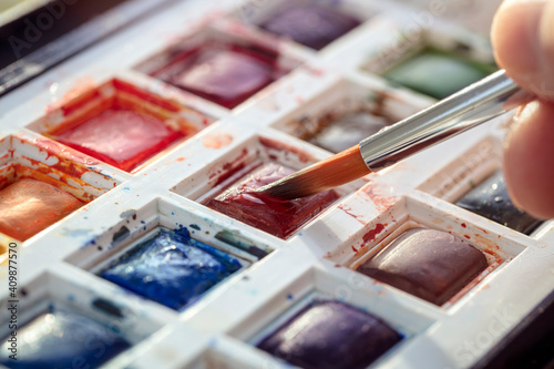 Artist's watercolor palette with brush © Brian Jackson