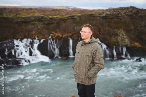 man at waterfall in Iceland