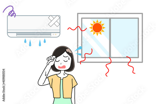 壊れたエアコンと女性