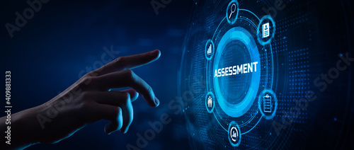 Assessment Evaluation Business Technology concept. Hand pressing button on screen. photo