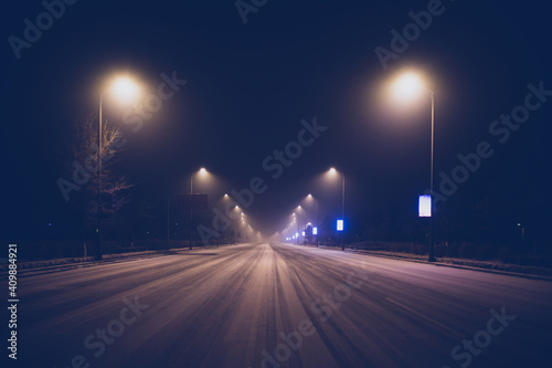 Street at night after snow in winter